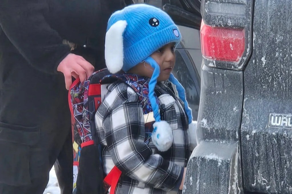 An ICE agent holds onto the backpack of Valley View Elementary student Liam Conejo Ramos, as he is being detained on Tuesday, Jan. 20, 2026, in a photo provided by Columbia Heights school officials.